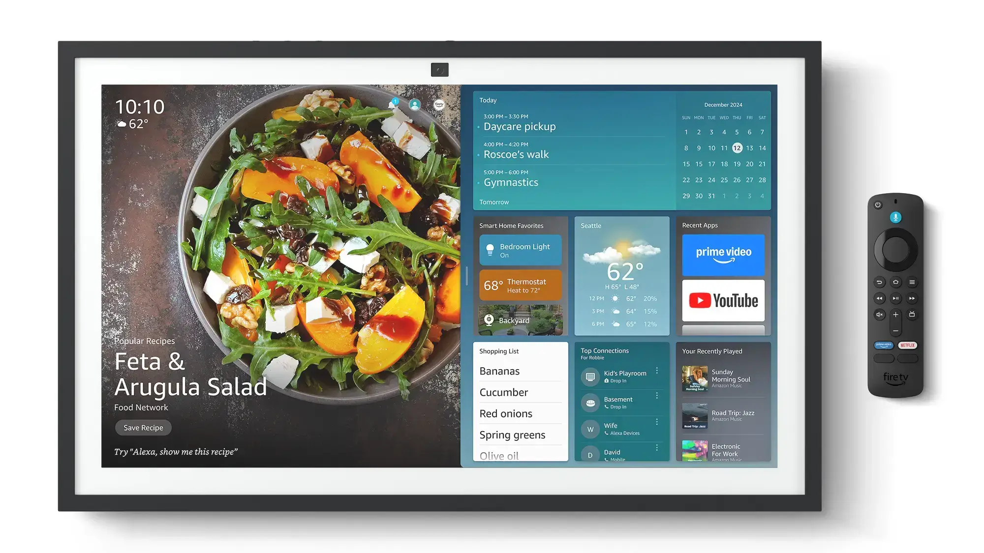 Amazon Echo Show 21 smart display showing home dashboard widgets and Fire TV remote.