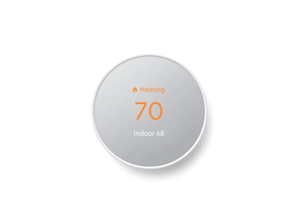 Google Nest Thermostat showing indoor temperature on digital display.