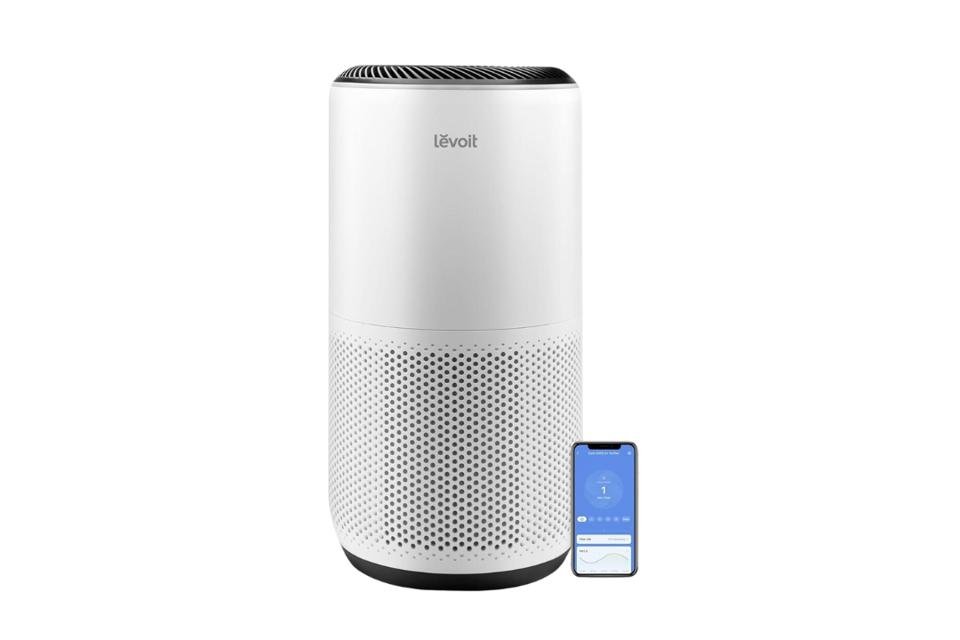 Levoit Core 400S Smart True HEPA Air Purifier shown next to a smartphone displaying its VeSync app control interface.